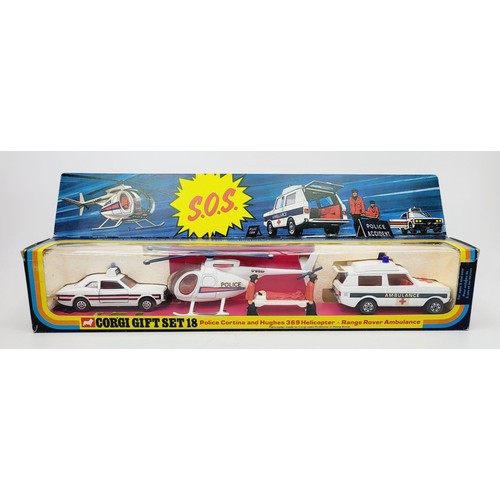 128 - A vintage boxed Corgi Police Cortina and Hughes 369 Helicopter - Range Rover Ambulance, Emergency Se... 