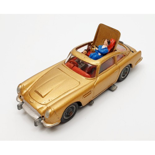 24 - A vintage boxed Corgi James Bond's Aston Martin D.B.5, 261 with inner display, Corgi toys leaflet an... 