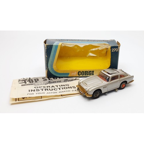 27 - A vintage boxed Corgi James Bond Aston Martin D.B.5, 270. UK shipping £14. We combine shipping.