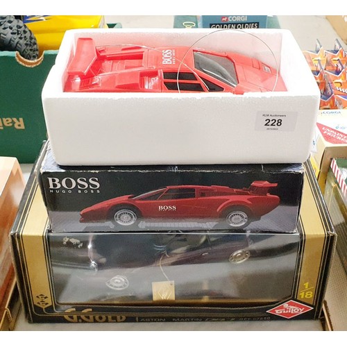 228 - A vintage boxed Hugo Boss remote control car together with a boxed model of an Aston Martin DB7. UK ... 