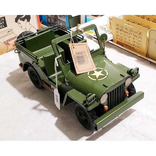 239 - A new tin plate model of a Willys Jeep, length 11.5