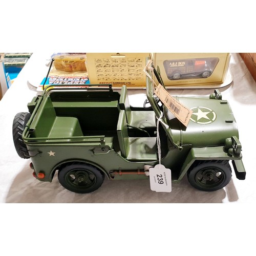 239 - A new tin plate model of a Willys Jeep, length 11.5