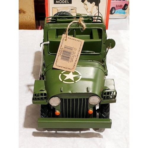 239 - A new tin plate model of a Willys Jeep, length 11.5