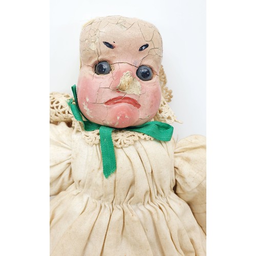 504 - Three antique wooden Punch and Judy puppets with plaster faces, with later fabric, the longest 22