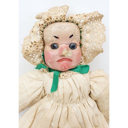 504 - Three antique wooden Punch and Judy puppets with plaster faces, with later fabric, the longest 22