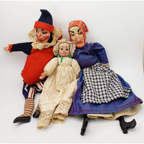 504 - Three antique wooden Punch and Judy puppets with plaster faces, with later fabric, the longest 22