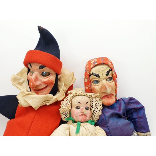 504 - Three antique wooden Punch and Judy puppets with plaster faces, with later fabric, the longest 22