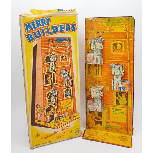 505 - A vintage boxed Codeg Merry Builders tin plate automatic action sand toy, height 16