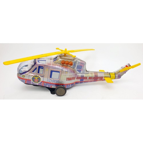 506 - A vintage boxed T.P.S. tin plate battery operated traffic control helicopter, length 15.5