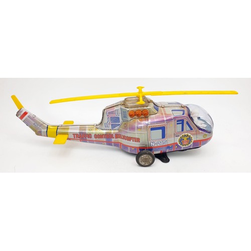 506 - A vintage boxed T.P.S. tin plate battery operated traffic control helicopter, length 15.5