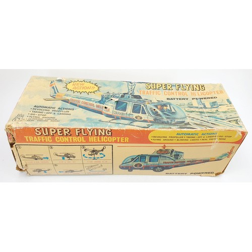 506 - A vintage boxed T.P.S. tin plate battery operated traffic control helicopter, length 15.5