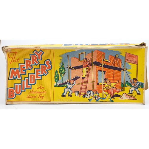 505 - A vintage boxed Codeg Merry Builders tin plate automatic action sand toy, height 16