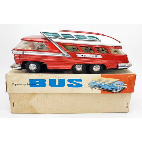 507 - A vintage boxed tin plate battery operated mystery action bus, length 11.5