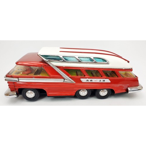 507 - A vintage boxed tin plate battery operated mystery action bus, length 11.5