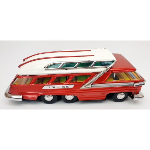 507 - A vintage boxed tin plate battery operated mystery action bus, length 11.5