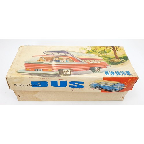 507 - A vintage boxed tin plate battery operated mystery action bus, length 11.5