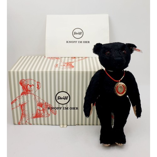 527 - A boxed Steiff Titanic Coin articulated teddy bear, length 11