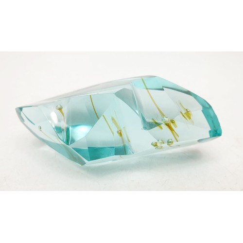 59 - A glass specimen with air bubble inclusions which have left coloured streaks, length 3.75