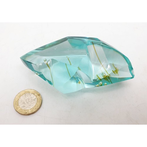 59 - A glass specimen with air bubble inclusions which have left coloured streaks, length 3.75