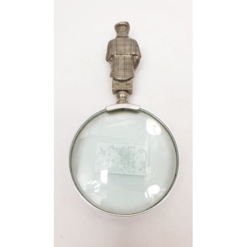 62 - A magnifying glass with a pewter handle in the form of Sherlock Holmes and 221B door, length 6.5
