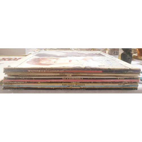 63 - Thirteen LPs including David Bowie, Scary Monsters, Simple Minds and Madness. UK shipping £14.