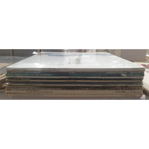 65 - Seventeen Country and Western LPs including Randy Travis and Dwight Toakam some sealed. UK shipping ... 