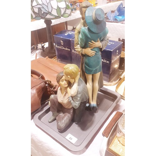 89 - Two resin Piazza figures, the tallest 15.5