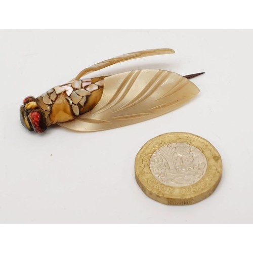 2 - A vintage pin in the form of an insect set with hard stones and abalone shell, length 2