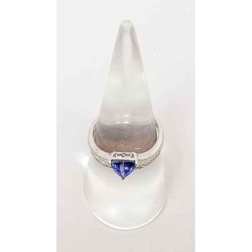 10 - An 18ct white gold tanzanite and diamond ring, size O, gross weight 2.9g. UK shipping £14.