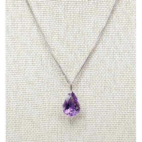 14 - An 18ct white gold amethyst set pendant on an 18ct white gold chain, chain length 15