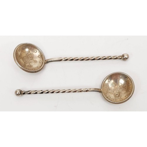 39 - A pair of salt spoons made from Islamic coins. UK shipping £14.