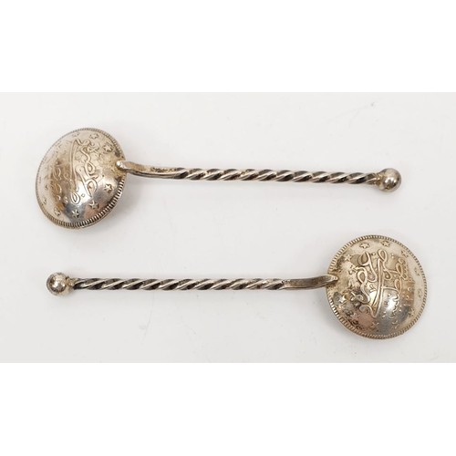 39 - A pair of salt spoons made from Islamic coins. UK shipping £14.