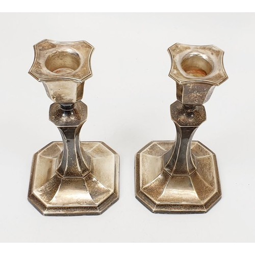 41 - A pair of weighted hallmarked silver candlesticks, height 5.75