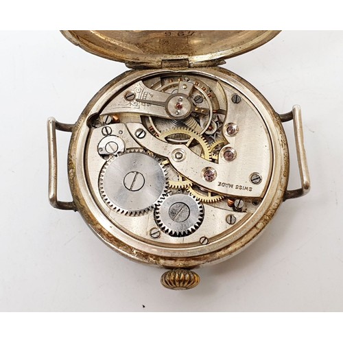 52 - An early continental silver cased wrist watch, London import hallmark 1919, diameter 1.25