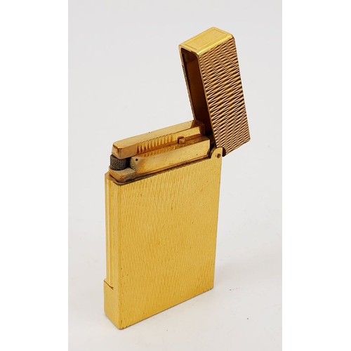 59 - A gold plated St Dupont lighter. UK shipping £14.