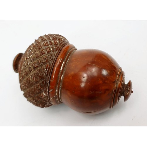 63 - An antique walnut needle case in the form of an acorn, length 2.75