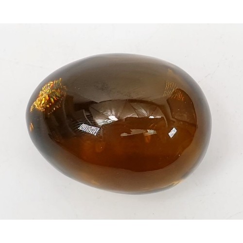 66 - A smoky quartz stone in the form of an egg, height 1.75