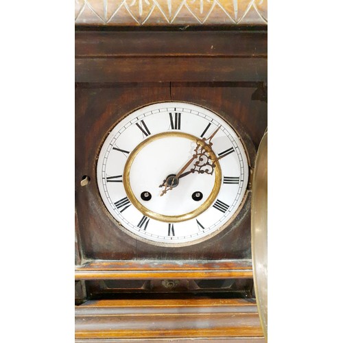 82 - An antique mahogany cased mantel clock, height 15.25