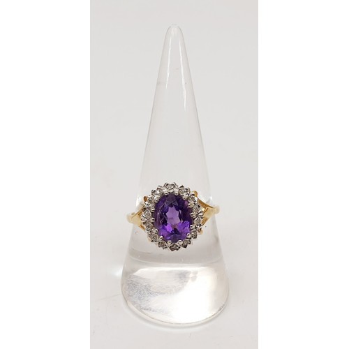 120 - A hallmarked 9ct gold ring set with diamonds and an amethyst, gross weight 3.4g, size R. UK shipping... 