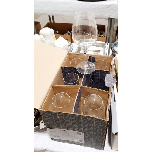 90 - A boxed set of six glass tumblers, a box set of six wine glasses and a set of Scott's of Stowe knive... 