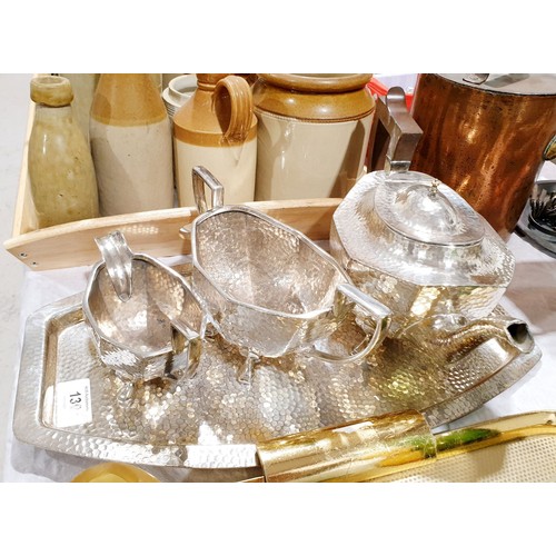 130 - A vintage three piece silver plated tea set with a hammer beaten finish and matching tray. UK shippi... 