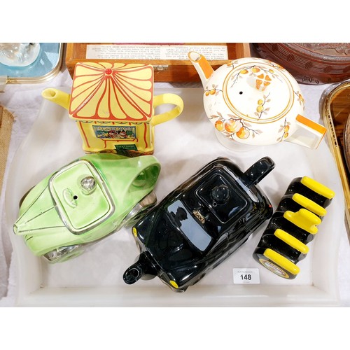 148 - Four vintage novelty teapots together with a Marmite toast rack. No shipping. Arrange collection or ... 