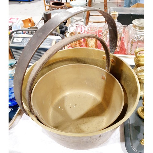 153 - Two antique brass preserve pans, the largest diameter 12.5