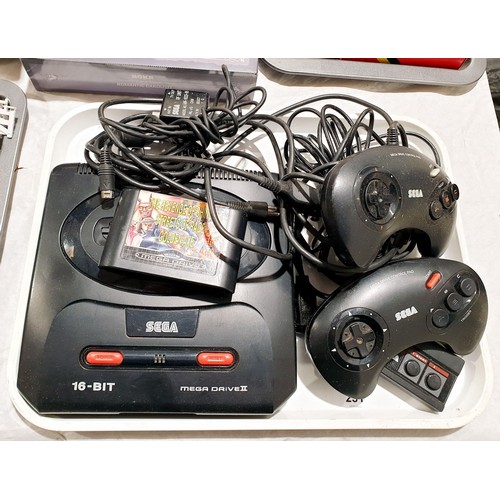 231 - A Sega Megadrive II with two controllers, a Megagames II games cartridge and a Sega Master System co... 