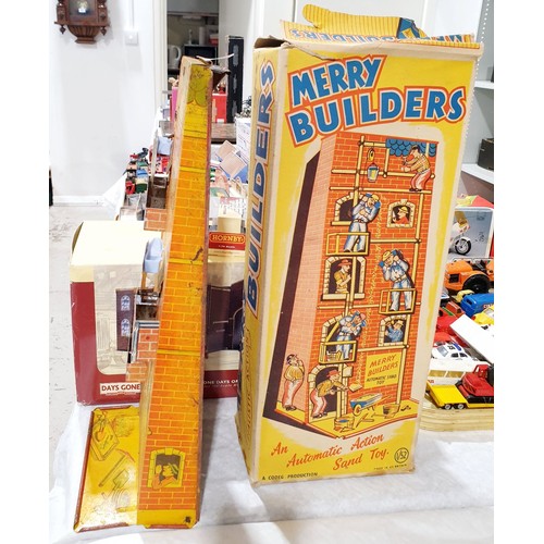 249 - A vintage boxed Codeg tin plate Merry Builders sand toy, height 16