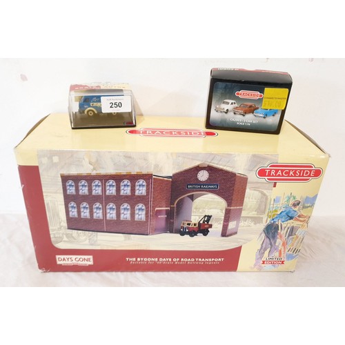 250 - A Lledo track side two piece tin plate railway depot and AEC wrecker-British Rail together with two ... 