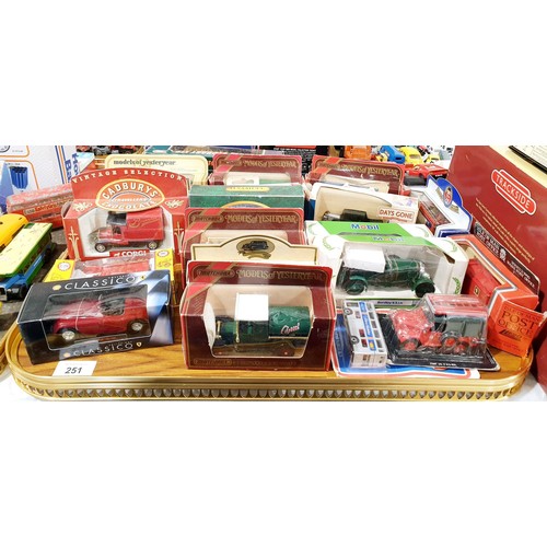 251 - A selection of boxed toy vehicles. UK shipping £14.