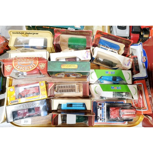 251 - A selection of boxed toy vehicles. UK shipping £14.