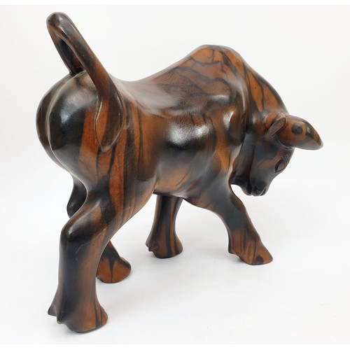 276 - A carved wooden bull, height 8.75