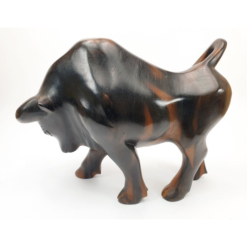 276 - A carved wooden bull, height 8.75